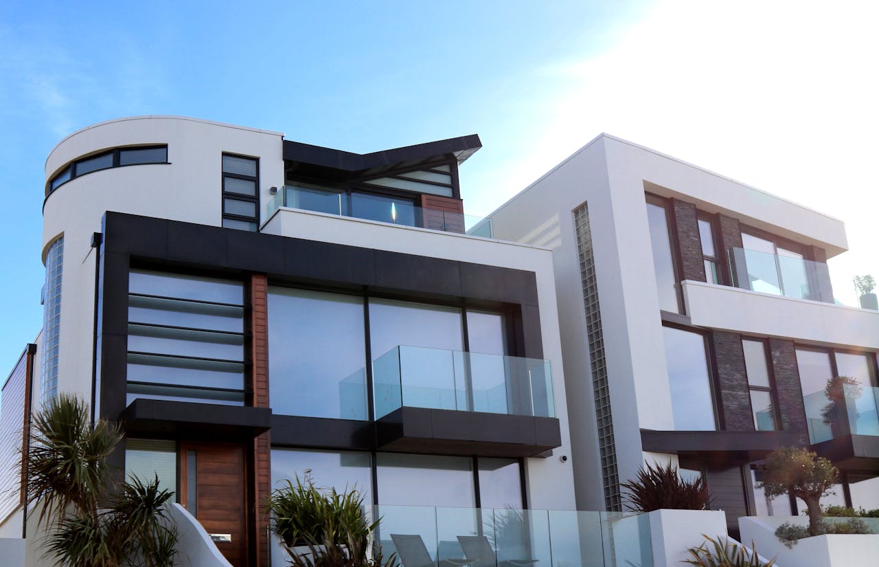 Services-02 Contemporary luxury home with glass balconies in Poole, UK, showcasing modern architectural design.